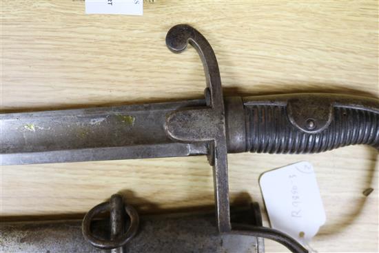 A Victorian sabre with etched blade and a mid 19th century sabre, both with scabbards